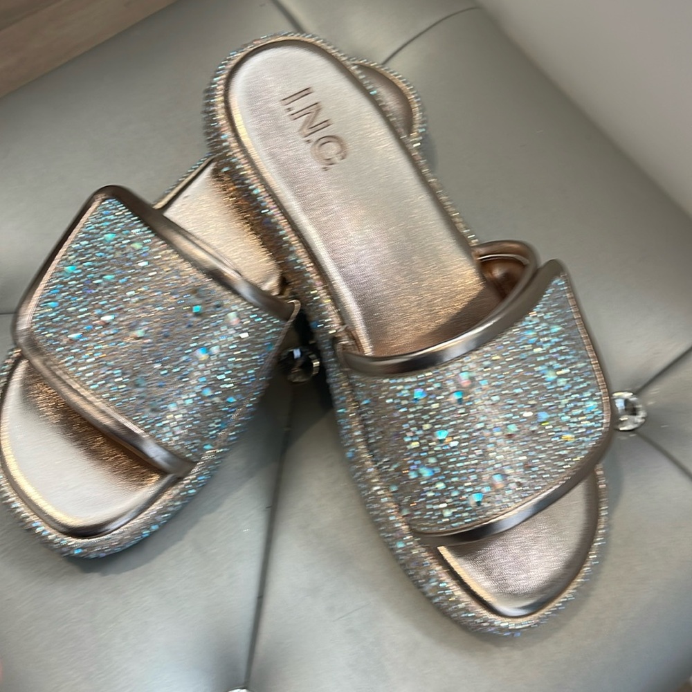 These are beautiful, pewter, colored sandals with rhinestones very bling